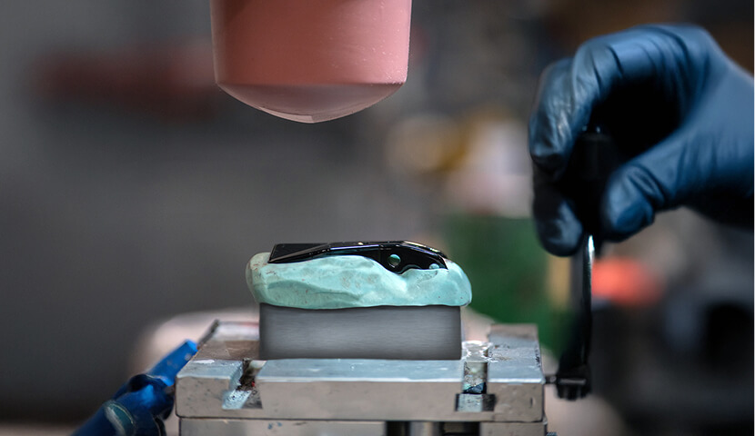 photo showing the pad printing process on a boot hook